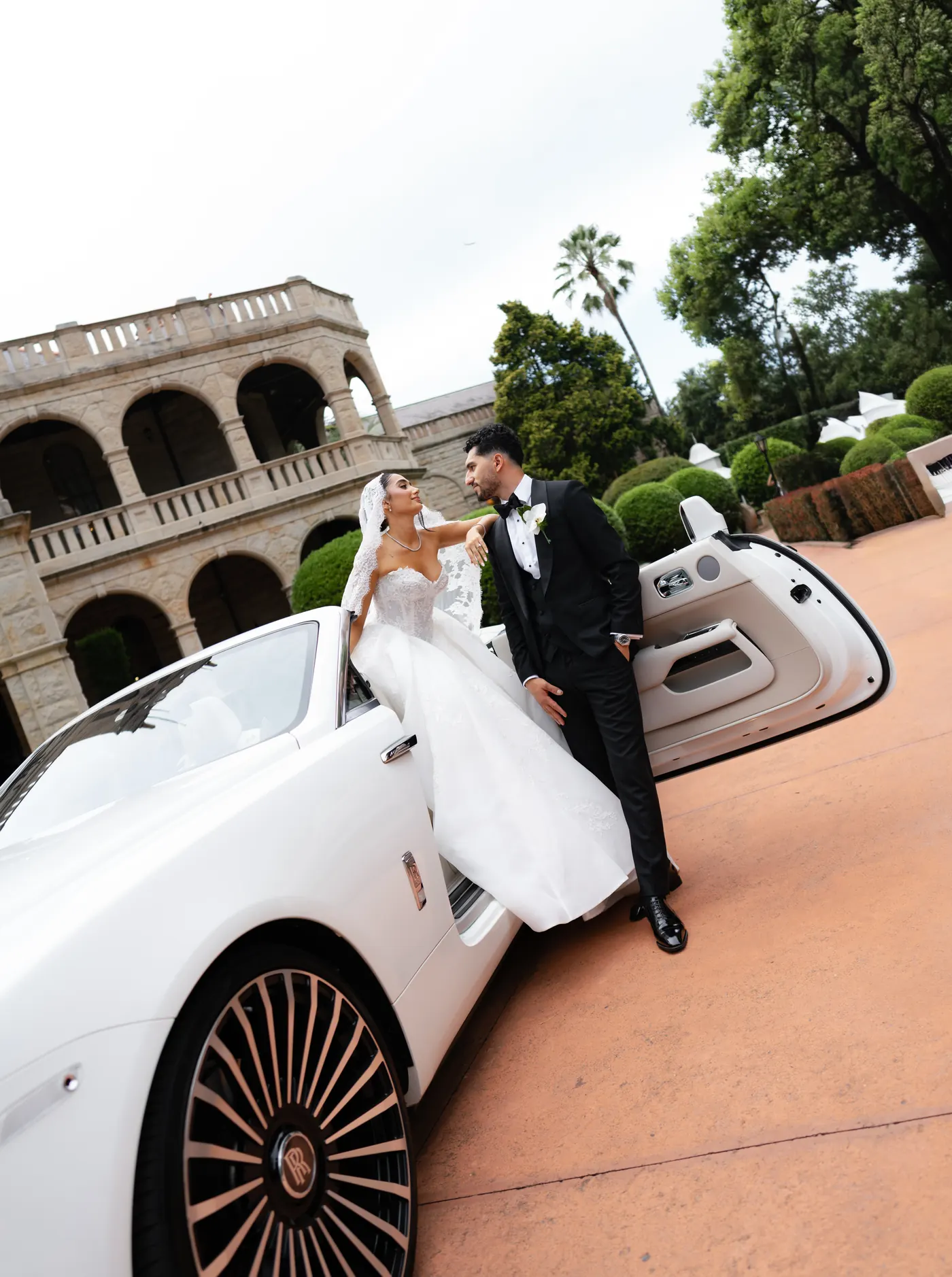 Couple with vintage convertible
