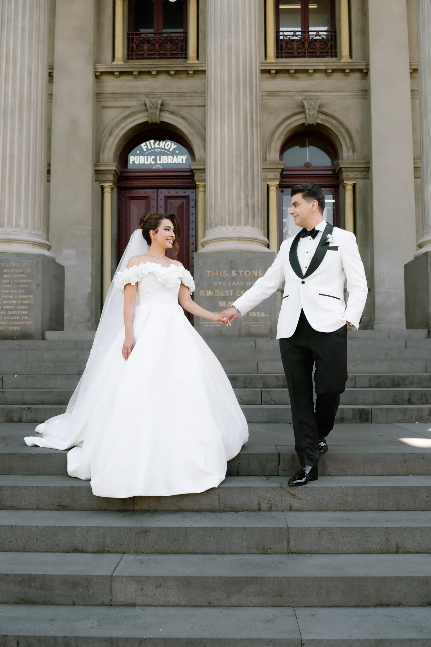 Couple on grand staircase